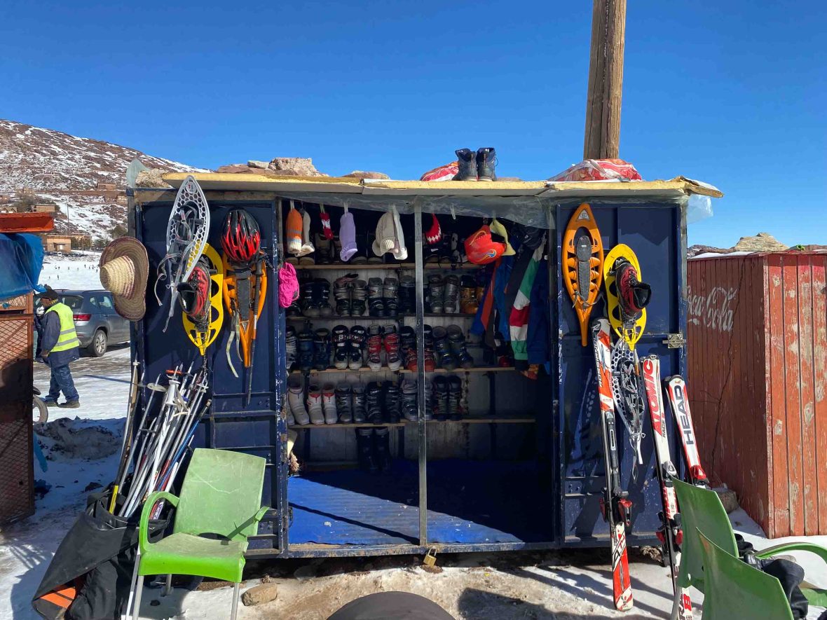 A small wooden hut with skiis and boots avaialble for rent.