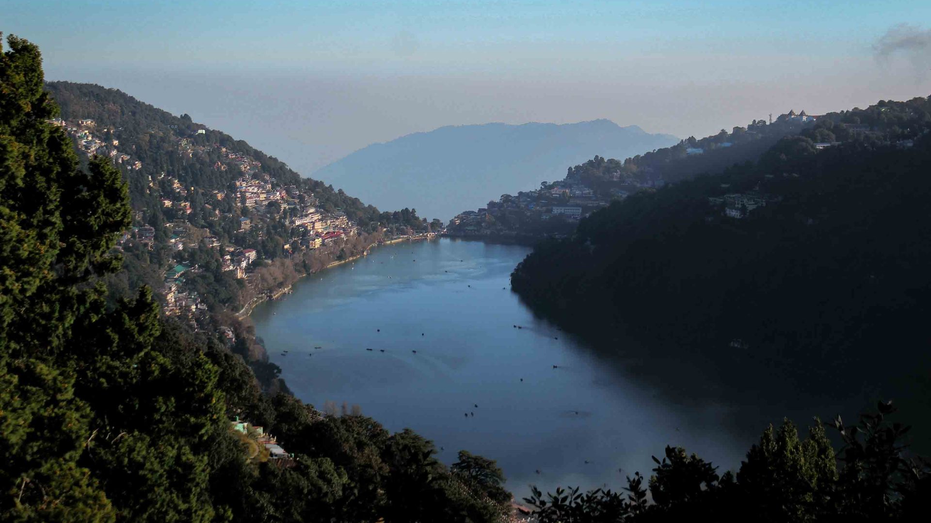 A view down over mountains and a lake.