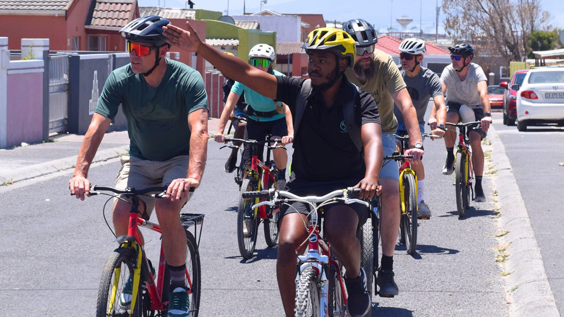 People ride on bicycles.