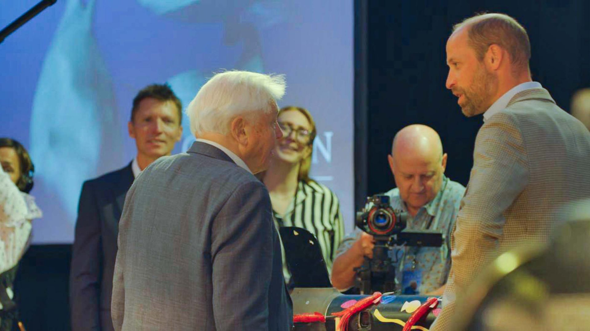 Gavin Thurston can be seen working behind the camera, filming David Attenborough and Prince William.
