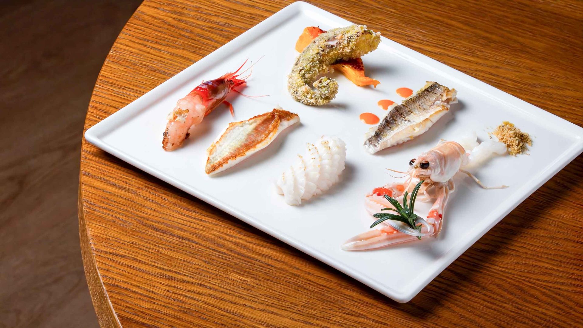 A plate of beautifully plated Japanese inspired sushi.