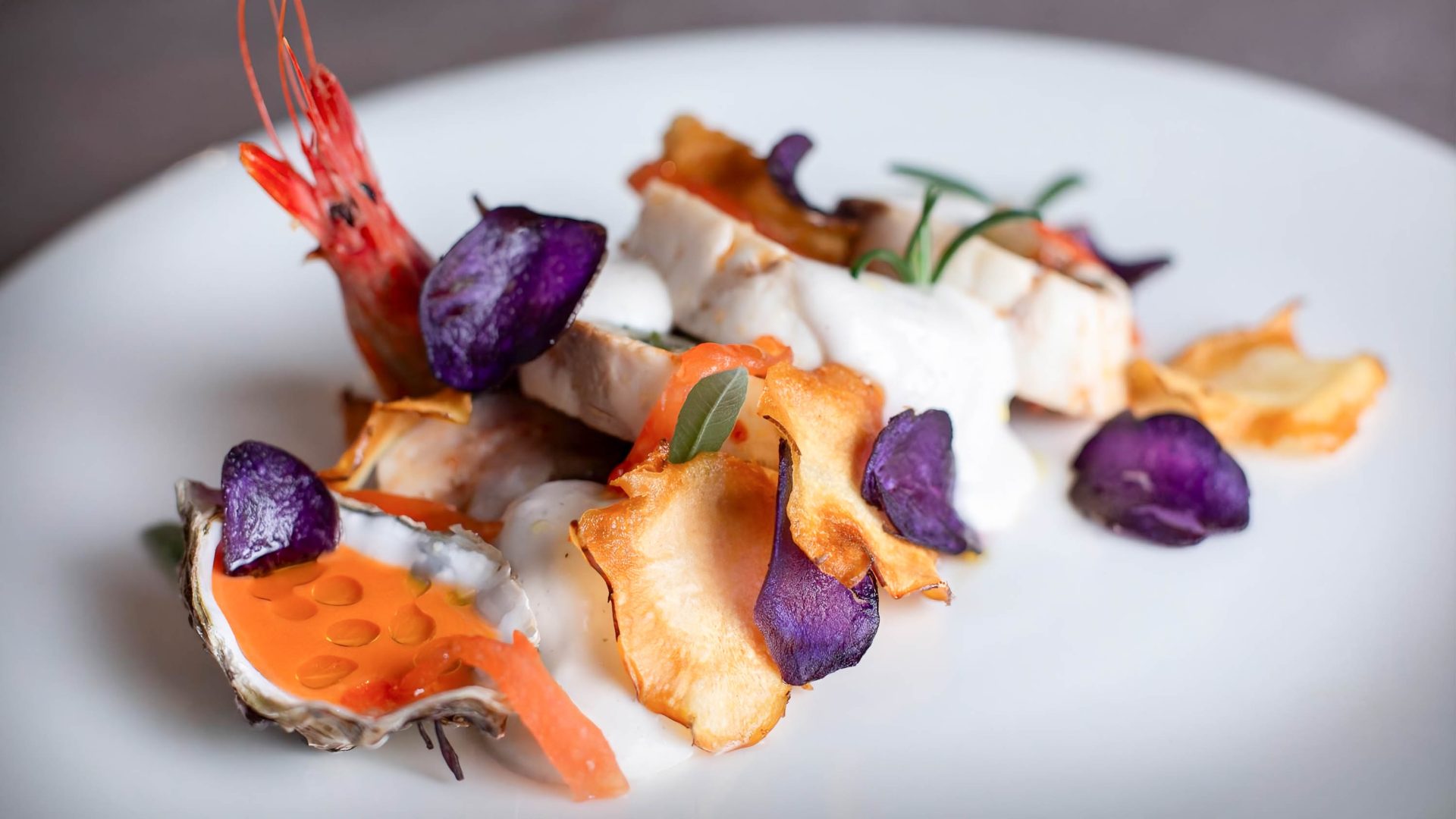 A plate of beautifully plated Japanese inspired food.