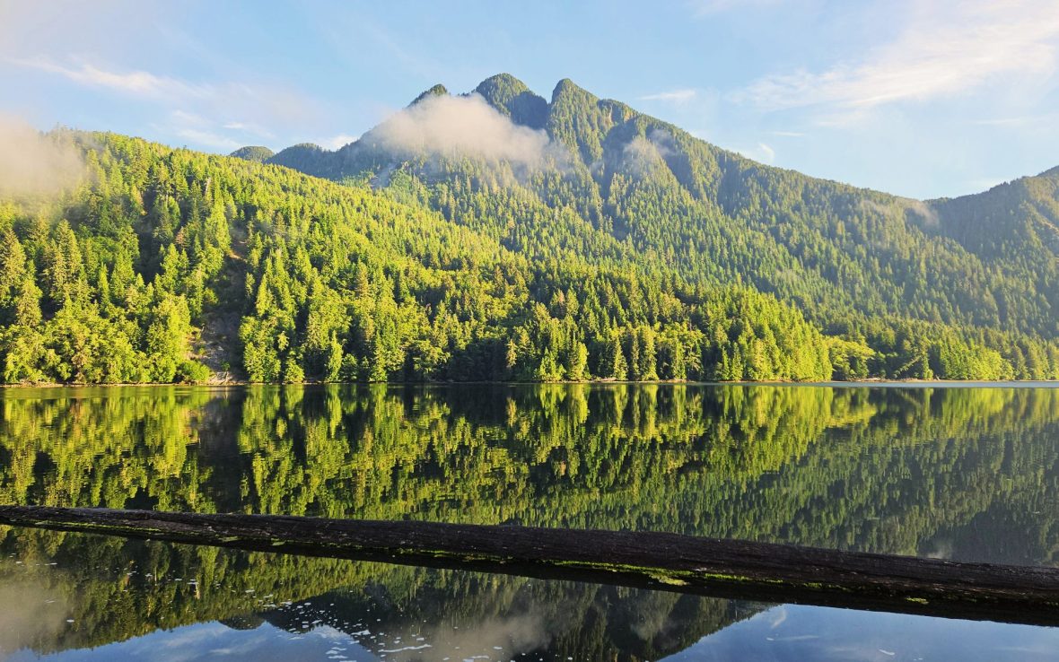 Green mountain above lake