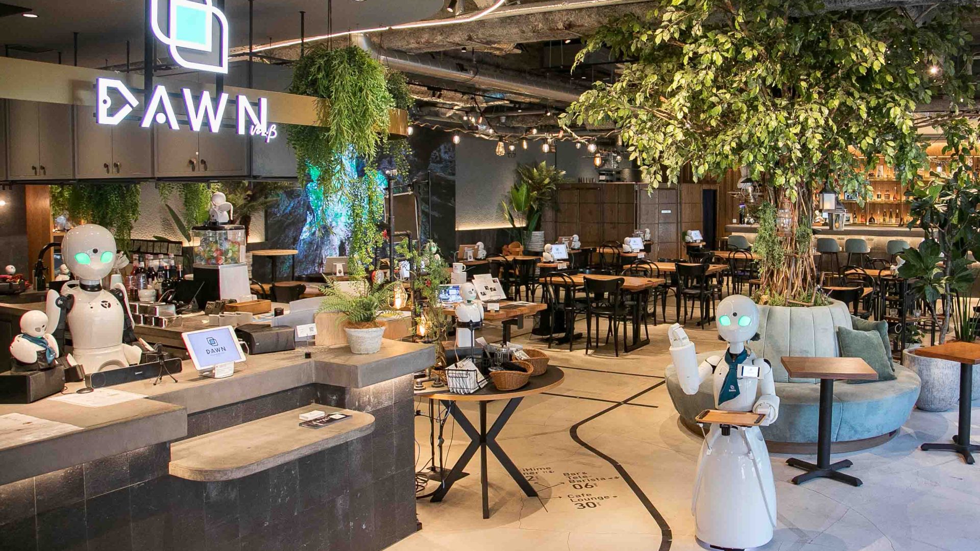 A robot walks through a restaurant.