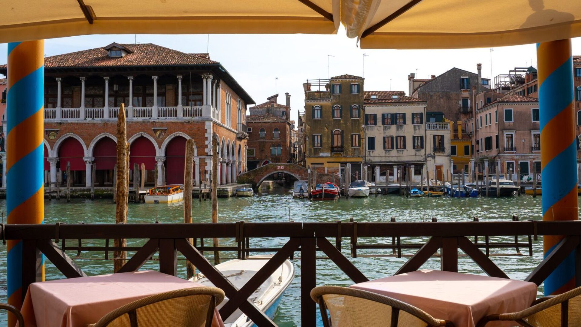 Two chairs facing canal water