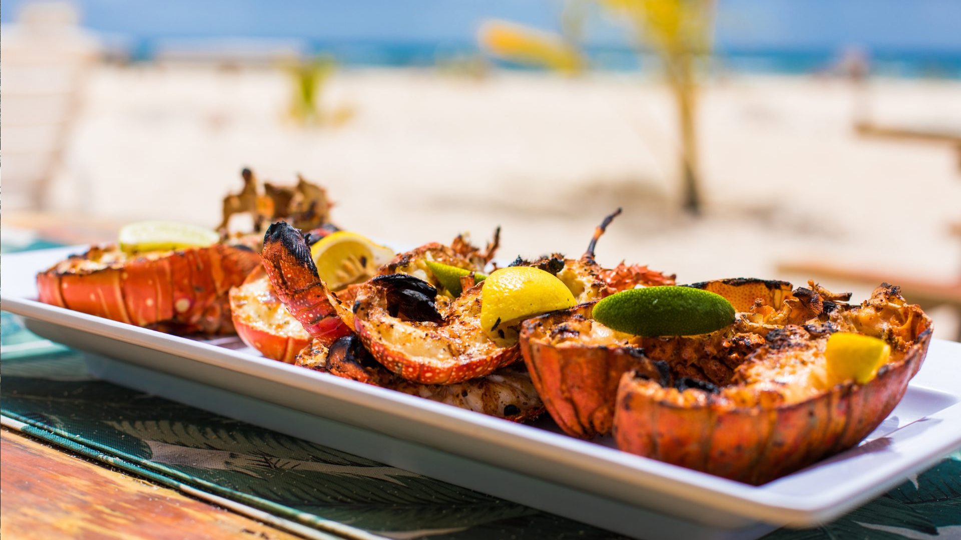 Lobster on white plate with lemon.