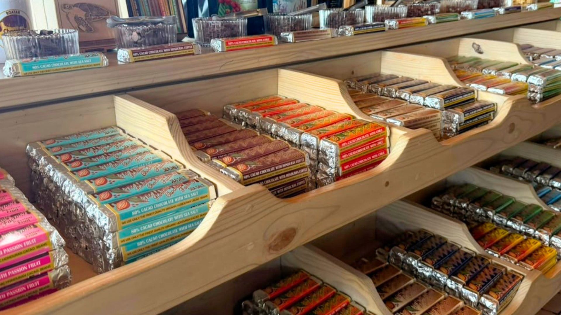 Chocolate bars line two shelves.