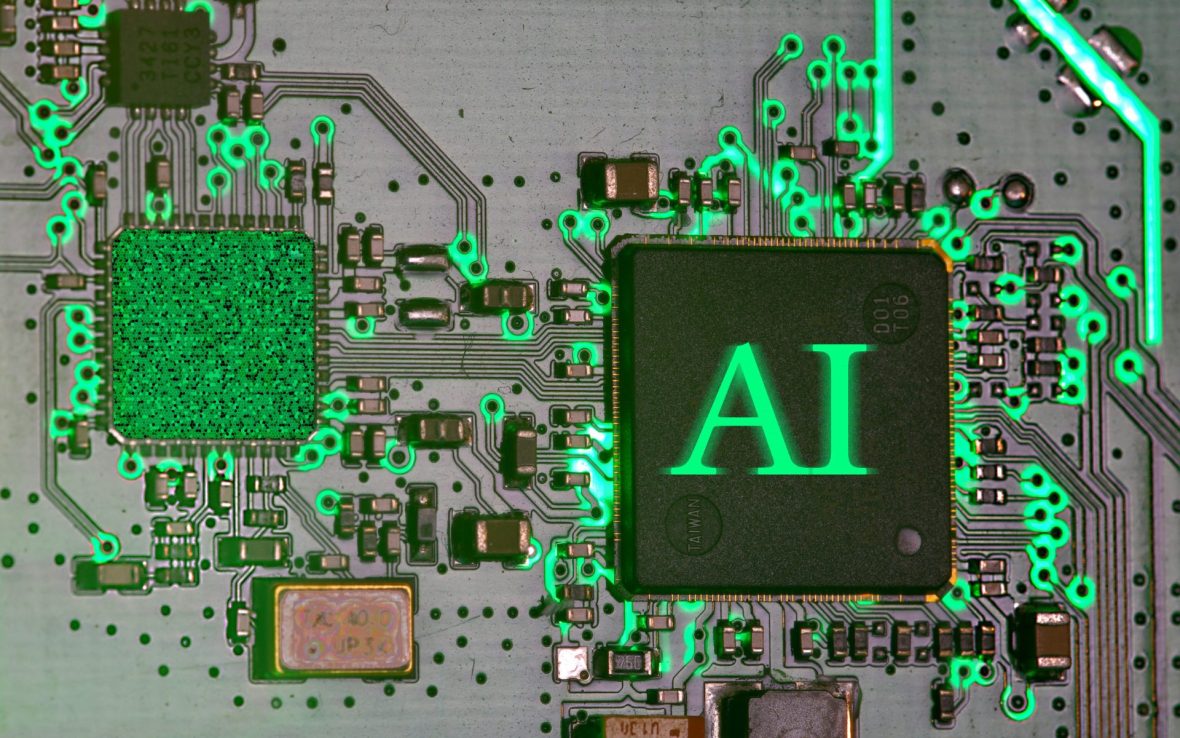 Interior of computer wiring with 'AI' on button.