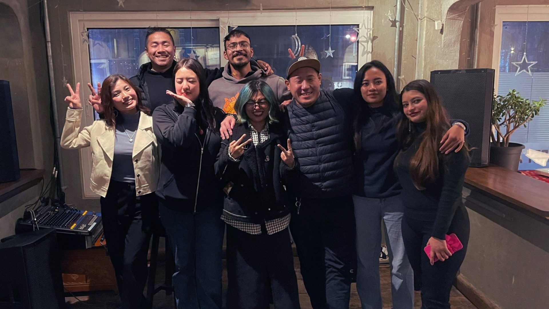 Group of friends smile at camera.