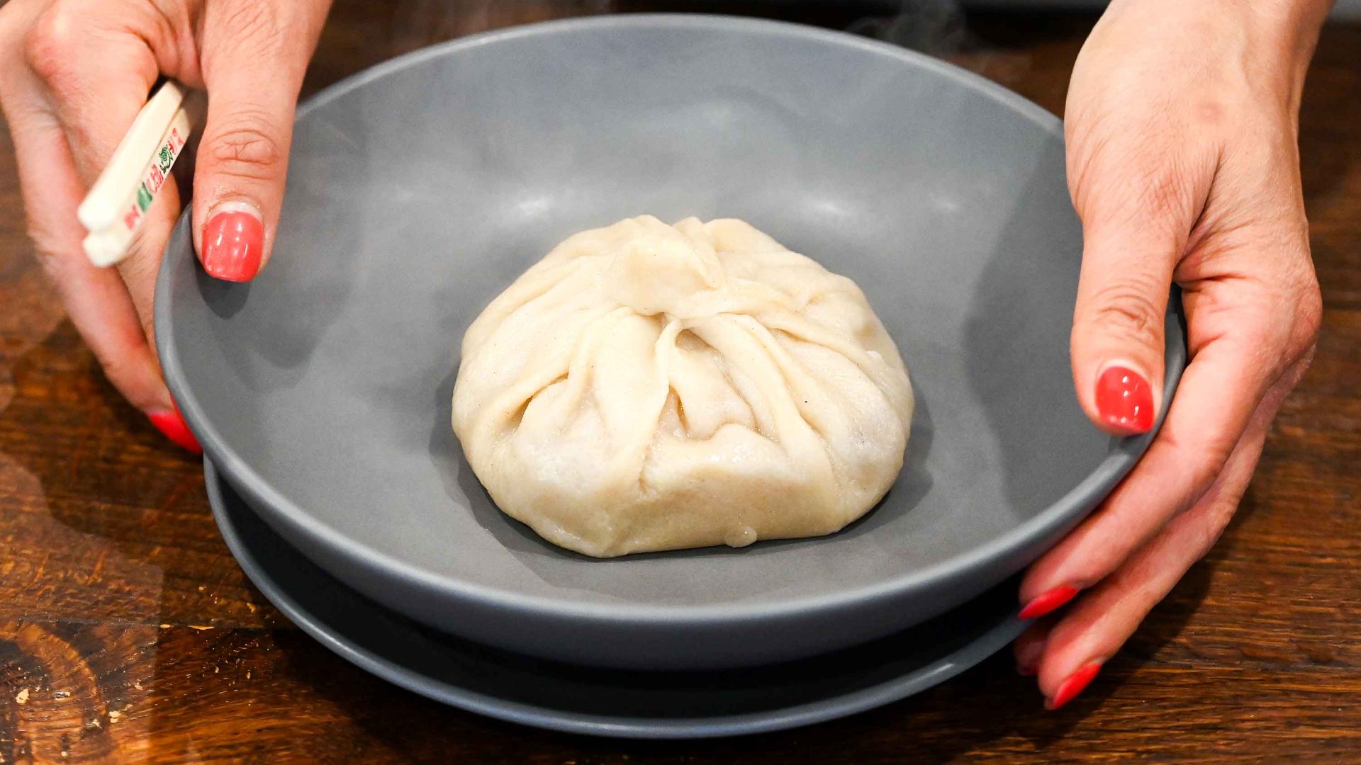 A large dumpling in a bowl.