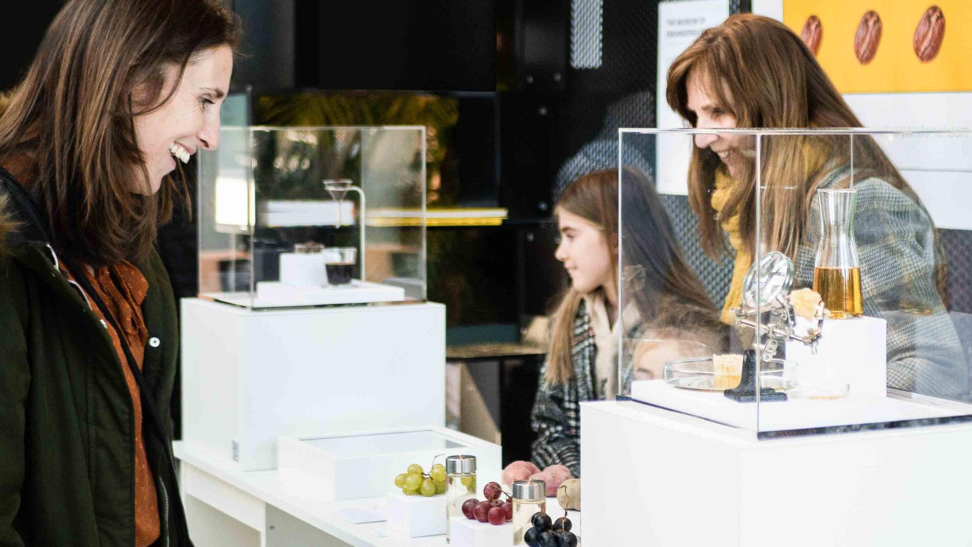 People look at a display of grapes.