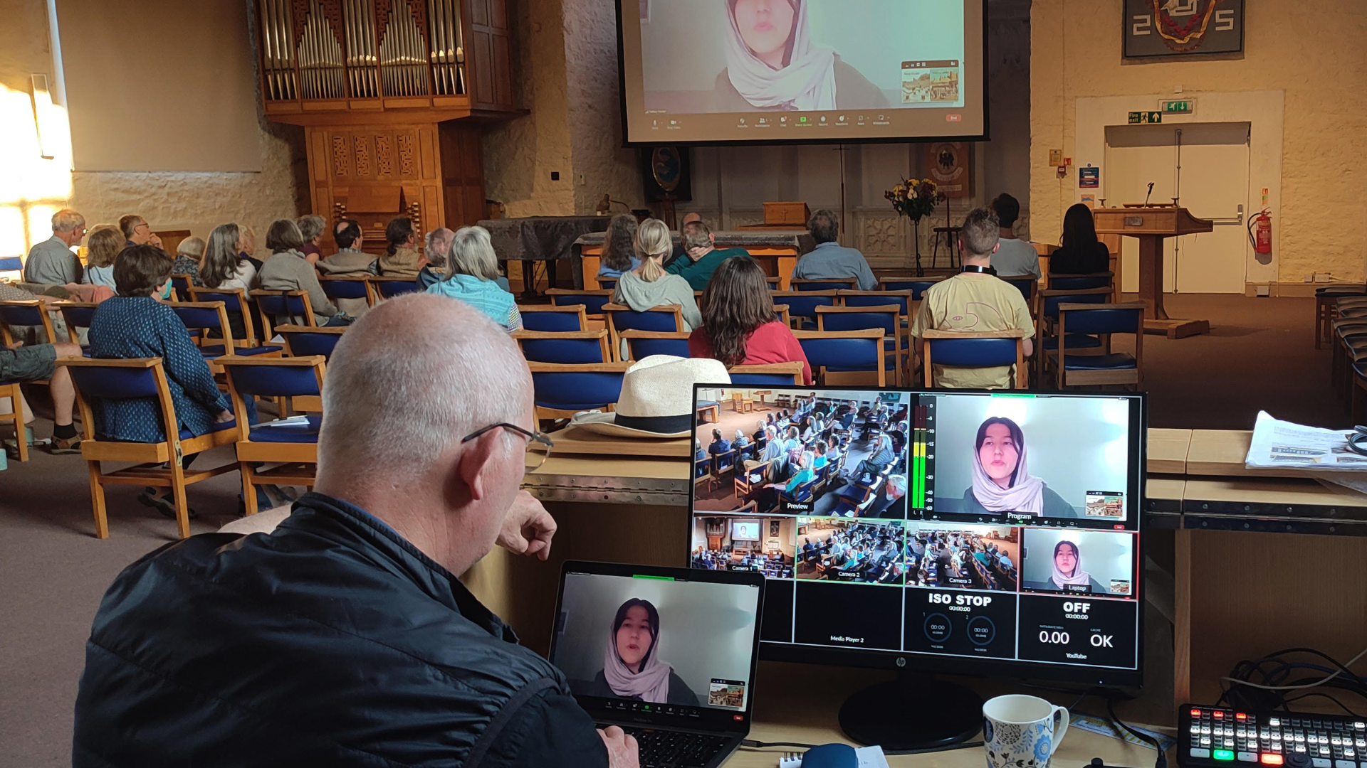 Multiple screens showing face of woman wearing scarf
