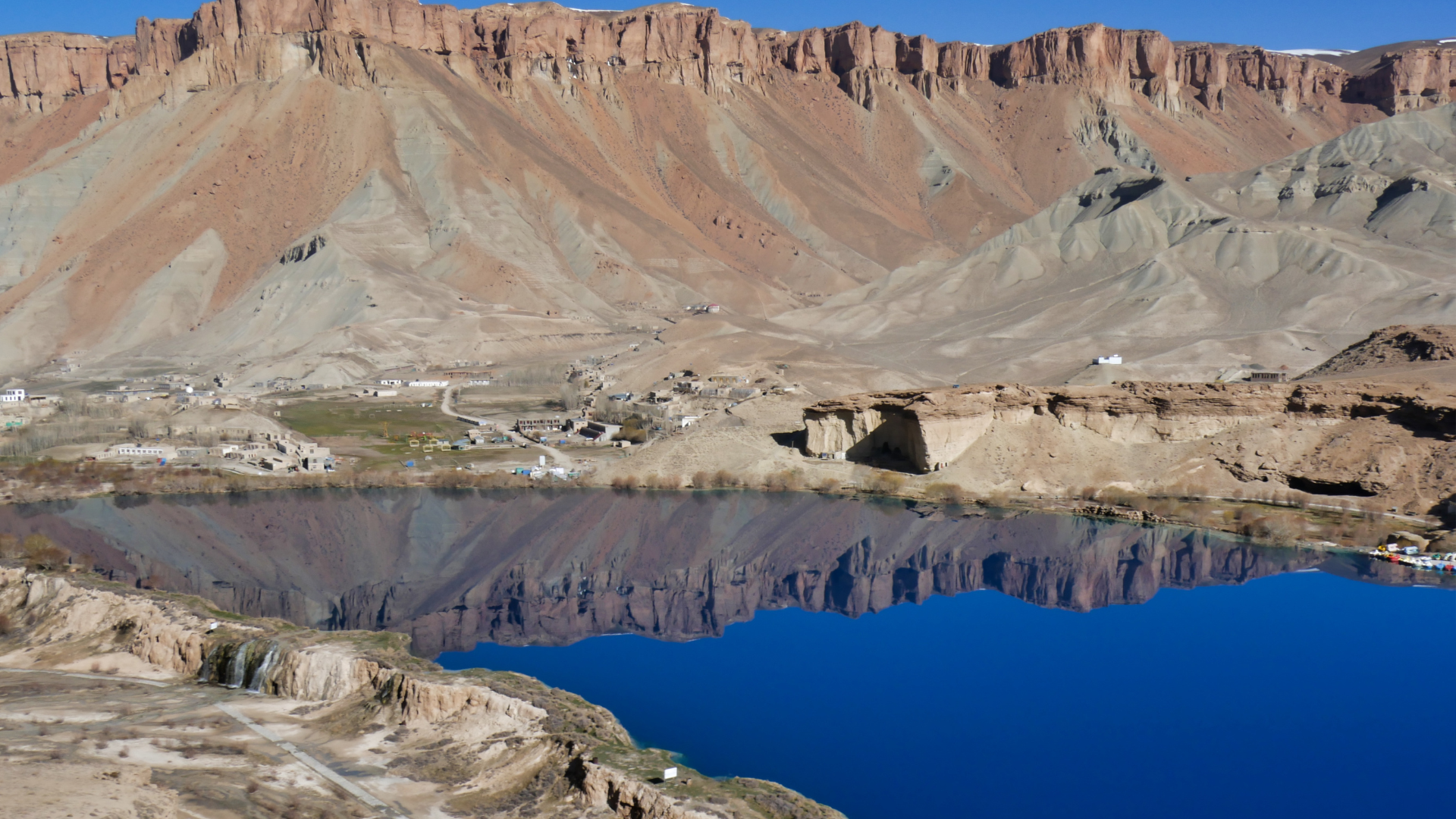 Sapphire lake under blue sky.