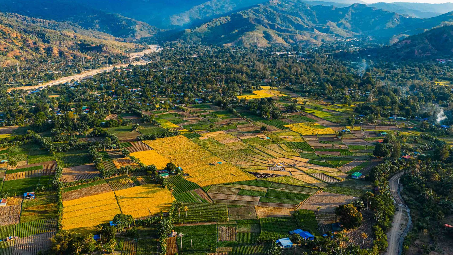 Fields and mountains are scattered with small towns..