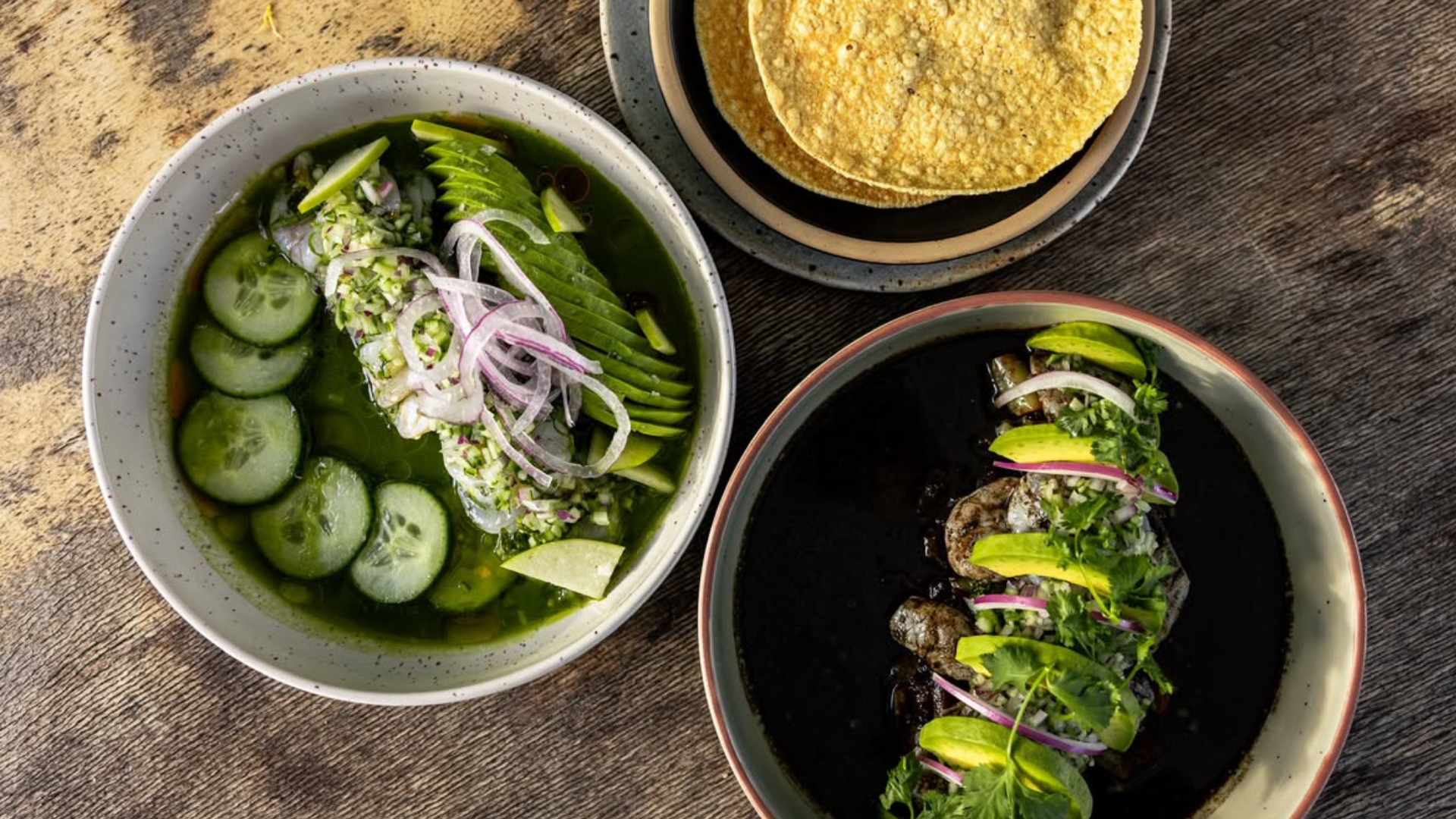Tortilla and bowls of fresh Mexican food