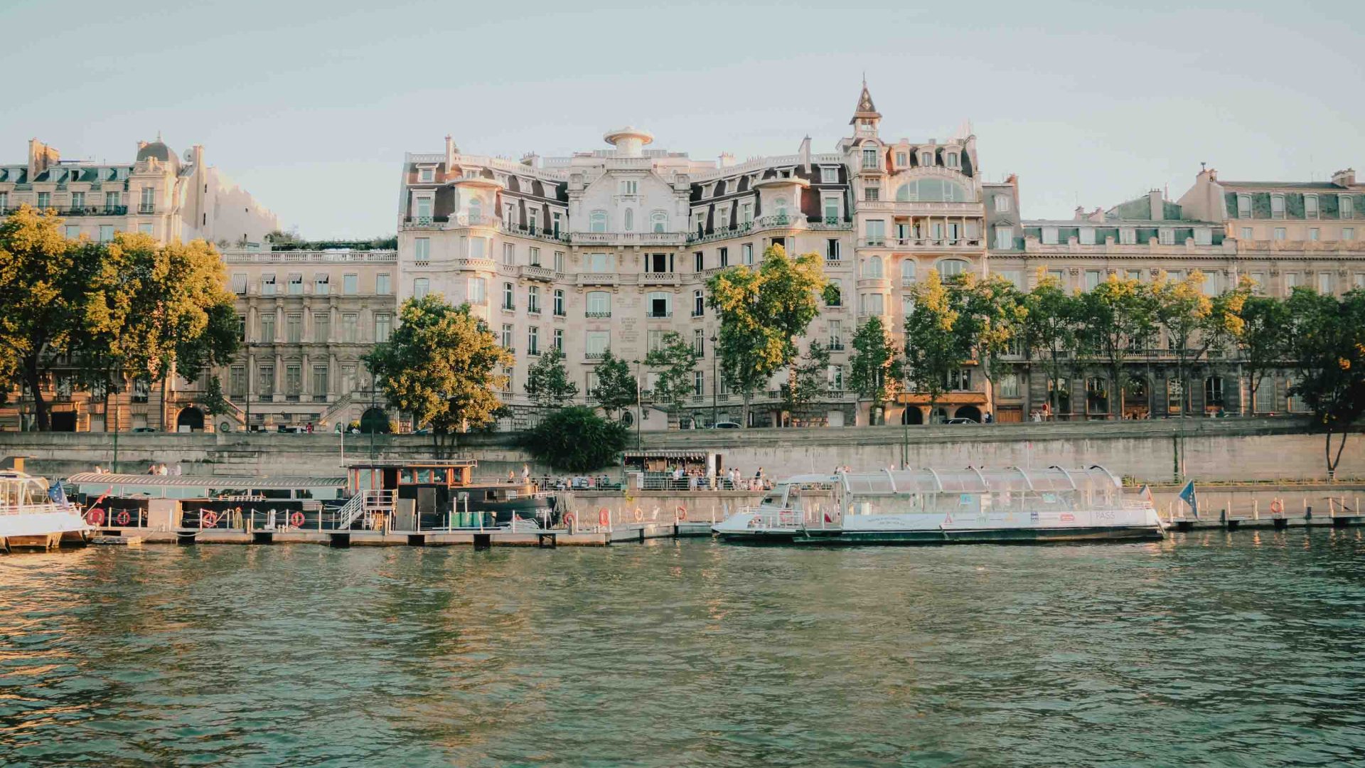 Buildings and boats along the banks of a river.